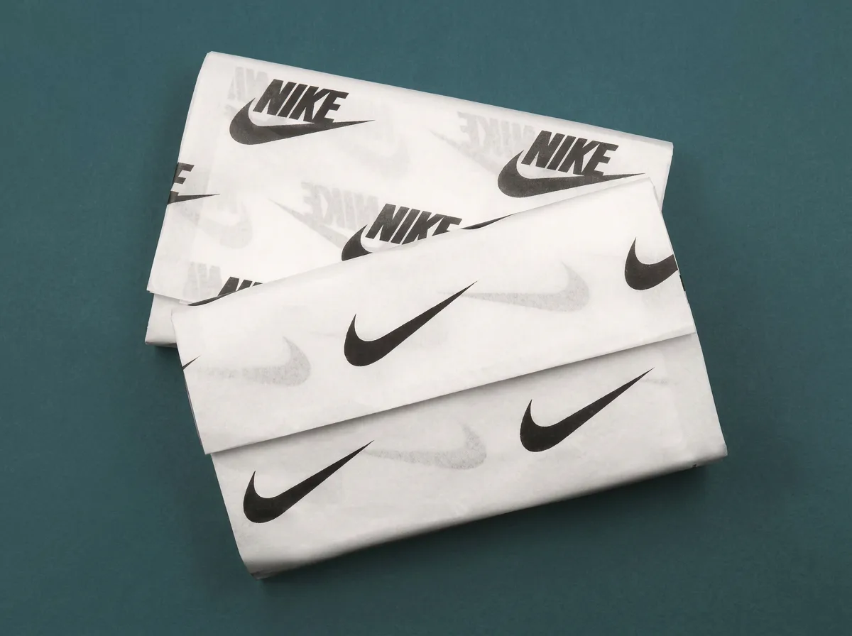 Personalised tissue paper with branded print used in premium product packaging